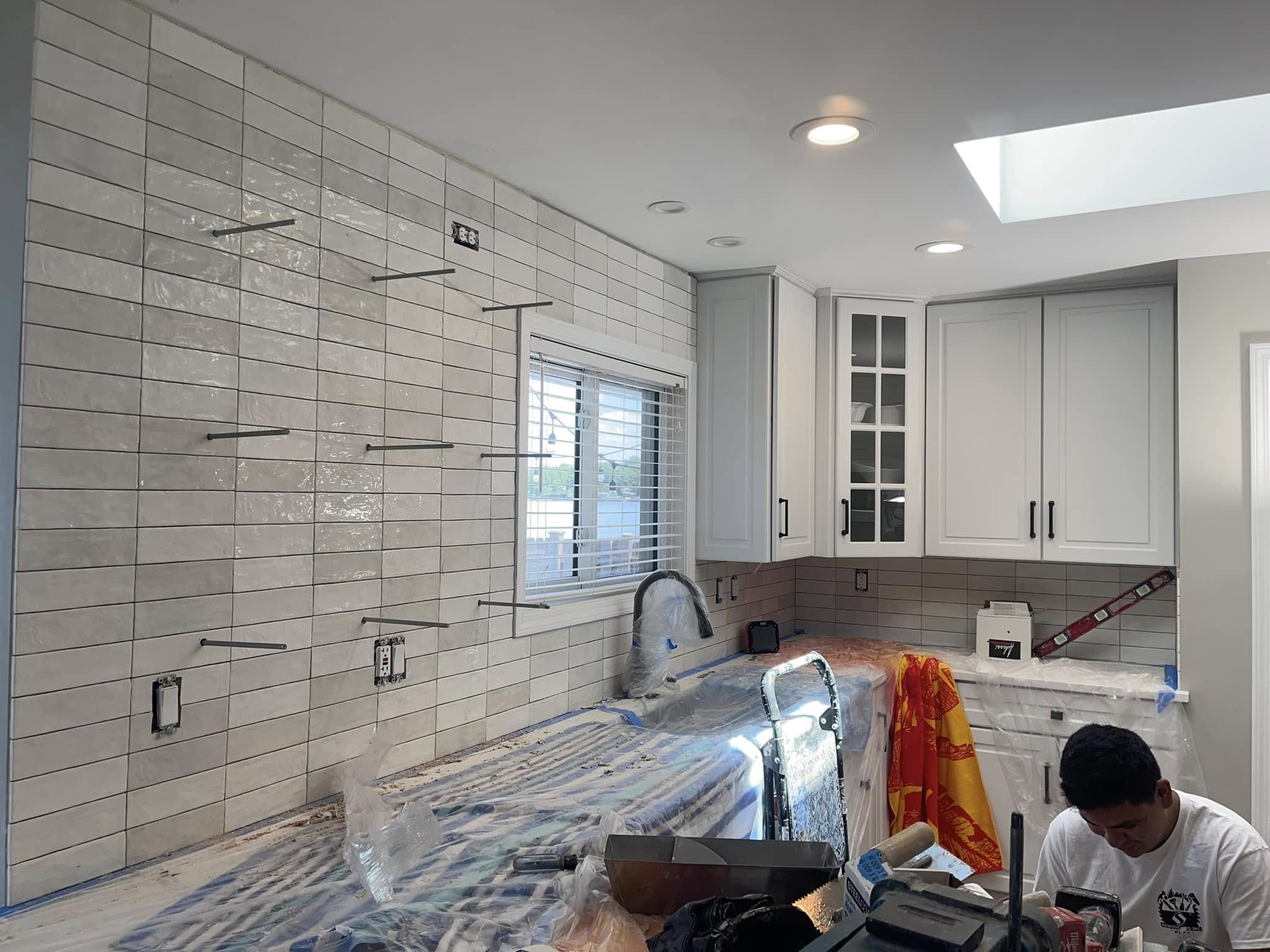 Kitchen tile installation in progress